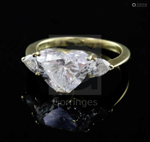A 1980's Kutchinsky 18ct gold heart shaped diamond set dress ring with pear cut diamond set