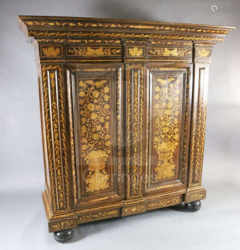 A 19th century Dutch walnut and marquetry armoire, with moulded pediment and two panelled doors