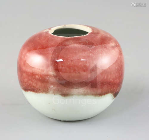 A Chinese copper red and white glazed globular water pot, 18th / 19th century, the mottled copper