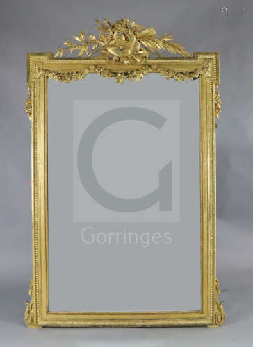 A late 19th French giltwood and gesso wall mirror, with musical pediment and floral swagged