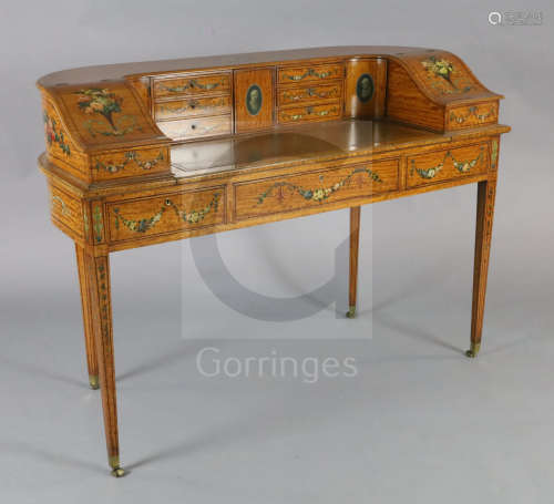 An Edwardian painted satinwood Carlton House desk, decorated with flowers and cameo portraits, the
