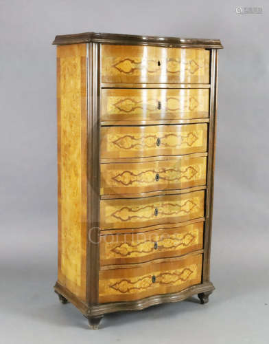 An early 20th century French rosewood and marquetry semanier, with serpentine front and block