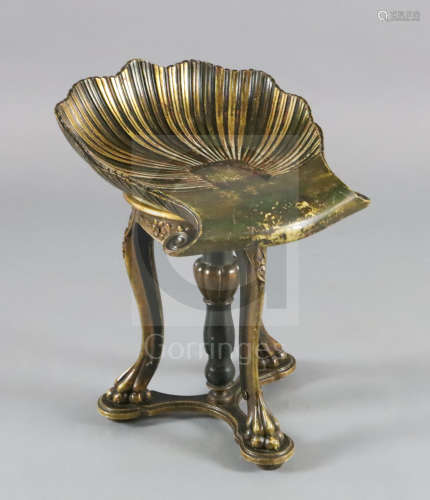 A 19th century parcel gilt green painted Venetian grotto style piano stool, with revolving scalloped