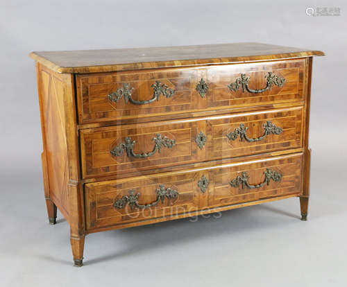 An 18th century German olivewood veneered commode with parquetry top and three long drawers fitted