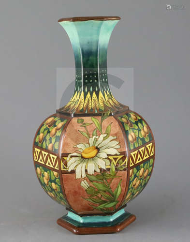 A Doulton Lambeth faience hexagonal baluster vase, c.1885, attributed to Mary Denley, painted with