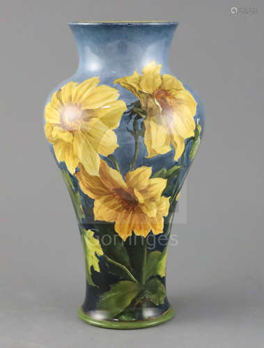 A Doulton Lambeth faience baluster vase, c. 1895, by Katharine B Smallfield, painted with sunflowers