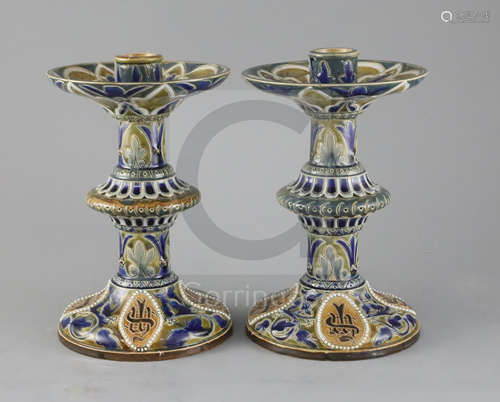 Edith D Lupton for Doulton, a pair of monogrammed candlesticks, dated 1879, each incised with