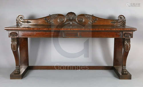 A Regency mahogany serving table, with scroll and scallop carved raised back and two frieze drawers,