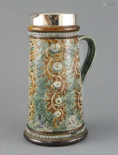 George Tinworth for Doulton Lambeth, a ewer of scroll and flowerhead design, dated 1879, with silver