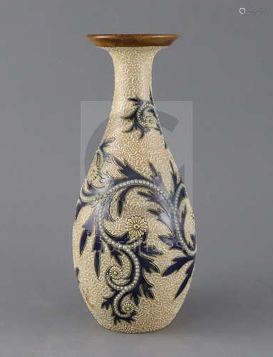 George Tinworth for Royal Doulton, a foliate and vermicular decorated bottle vase, c.1905, impressed