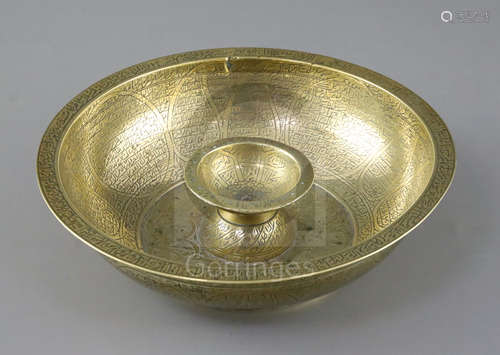 A large brass Persian magic bowl, Qajar dynasty, with inscribed decoration, Diam. 8.25in.