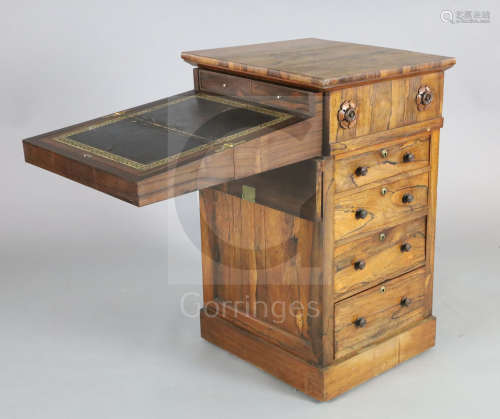 A William IV rosewood davenport, of unusual design with swivelling top enclosing writing slope and