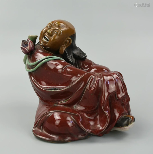 Chinese Shiwan Seated Man w/ Lotus Blossom,20th C.