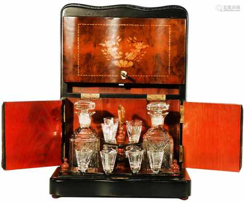 A wood liquor-cellarette with two caraffes and liquor glasses. After earlier example.