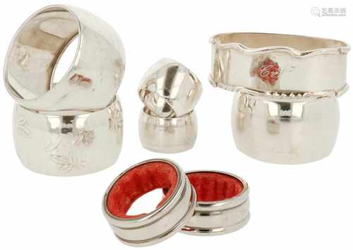 (8) Pieces of silver napkin rings.