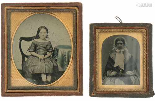 A lot with (2) picture frames with Daguerrotype of a lady with child. Ca. 1910.