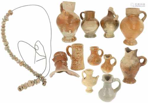 A collection of archeological findings a.o. jugs.