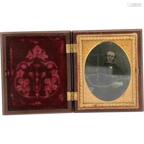 A bakelite picture frame with Daguerrotupe of a gentleman - ca. 1910.