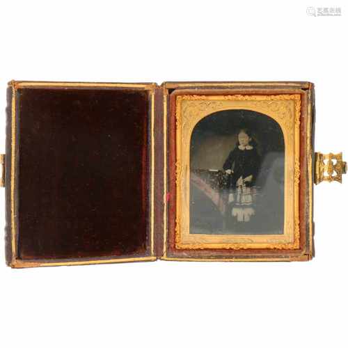 An antique picture frame with Daguerrotype of a girl.