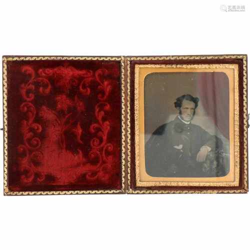 An antique picture frame with Daguerrotype of a gentleman.