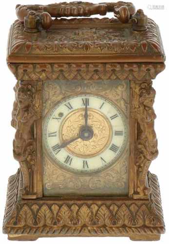 An ornamented brass carriage clock. Late 19th century.