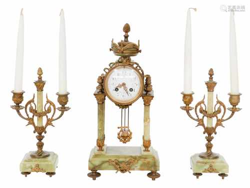 A mantel clock set with green onyx. France, late 19th century.