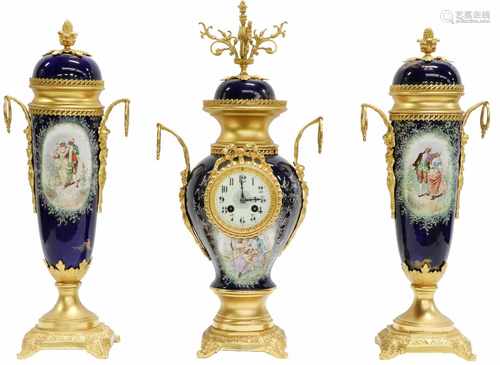 A porcelain mantle clock set with bronze ornamental mounts. France, mid 20th century.