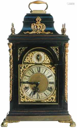 A wood table clock with bronze mounts. First half 20th century.