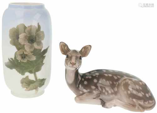 A porcelain fallow deer figurine together with a vase decorated with flowers. Royal Doulton.