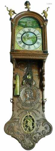 An elaboratly carved clock. Early 19th century.