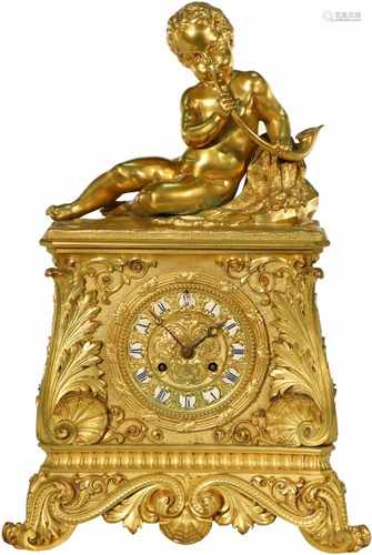 A firegilt clock with music playing boy. Denière a Paris. France, 19th century.