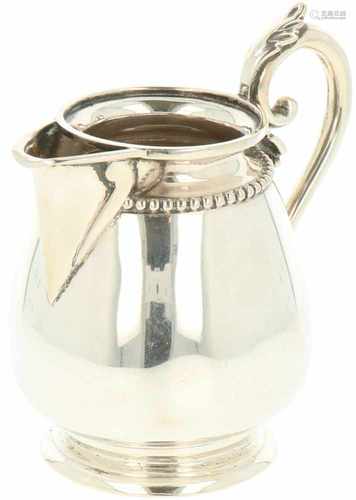 Small silver creamer.