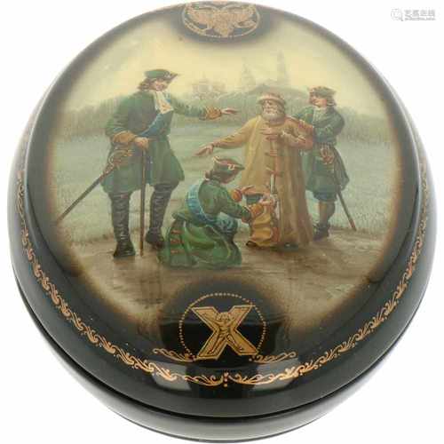 An oval Russian lacquer box with depiction of Czar Peter the Great who appears to collect taxes