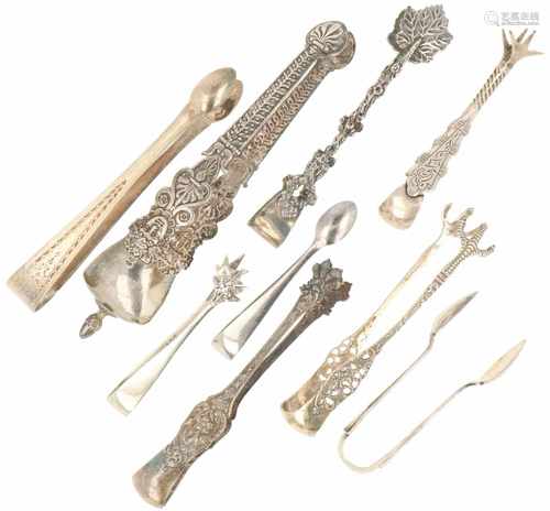 (9) Piece lot with sugar cube and rock candy tongs.