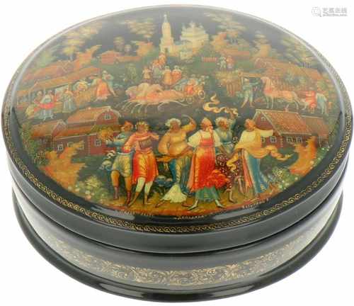 An oval Russian lacquer box with depiction of a wedding of peasants.