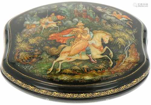 A Russian lacquer box with depition of a fary tale.