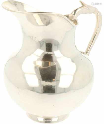 Silver water jug.