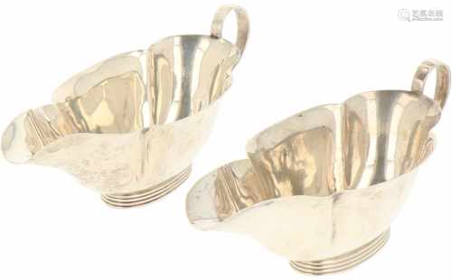 (2) Silver sauce boats.