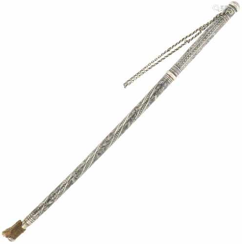 Silver riding crop.