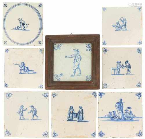 A lot with (8) 'Delft' tiles with various motifs, amongst which one framed. Different ages.