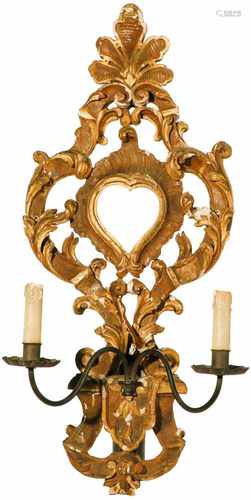 An early 18th century French Louis XIV hand carved wall applique with two candle holders.