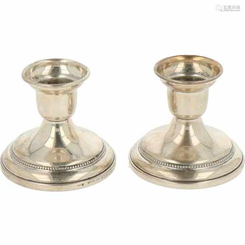 (2) Piece set of silver miniature candlesticks.