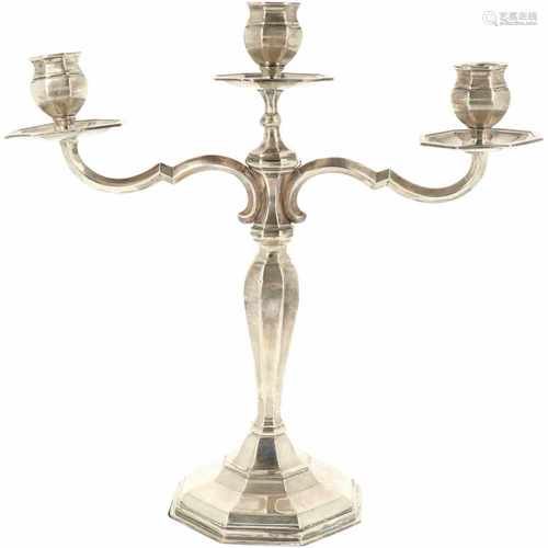 Silver three-arm candlestick.