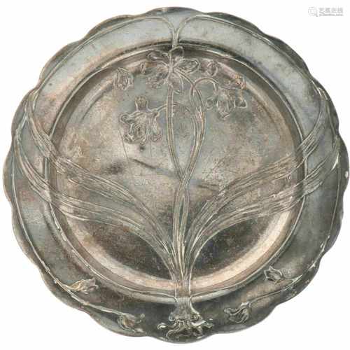 A WWF-style plate with floral motif. Pewter.