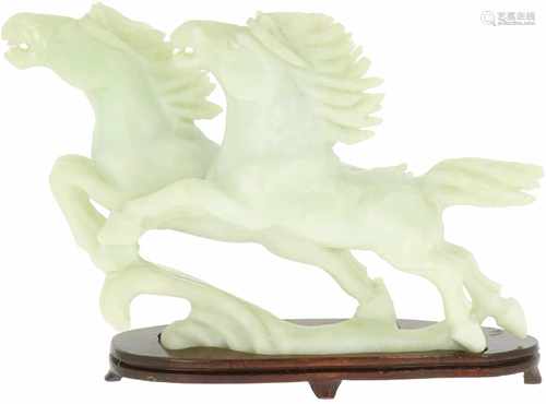 A soapstone statuette depiciting two running horses. China, late 20th century.