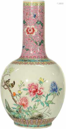 A porcelain baluster shaped vase with floral décor. China, 2nd half 20th century. 