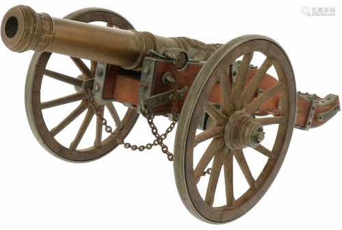 A scale model of a 19th century desk canon with double headed eagle and czar crown. Ca. 1900.