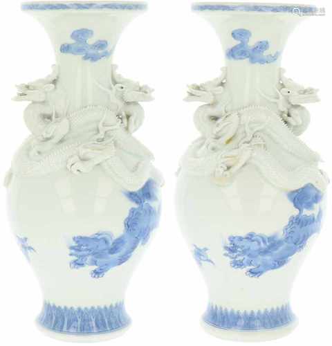 A set of two porcelain vases decorated with dragons. China, mid 20th century.