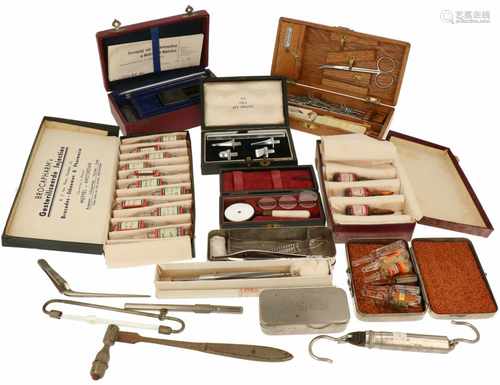 A very large collection of medical equipment a.o. an ulster, a magnet pen, tweezers, a cutting