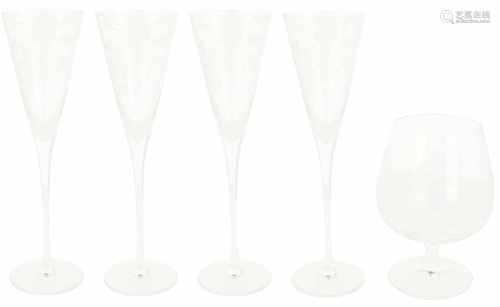 A set cut glasses consisting of four champagne glasses and a brandy glass. France, late 20th